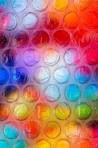 close up bubble wrap on multicoloured background