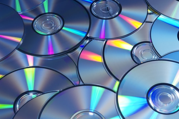 High angle view and blue tinted image of DVDs