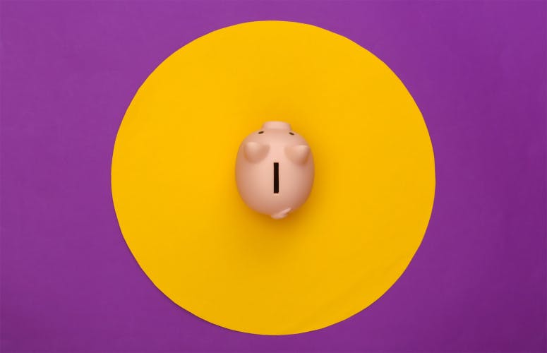 Piggy bank on purple background with yellow circle.